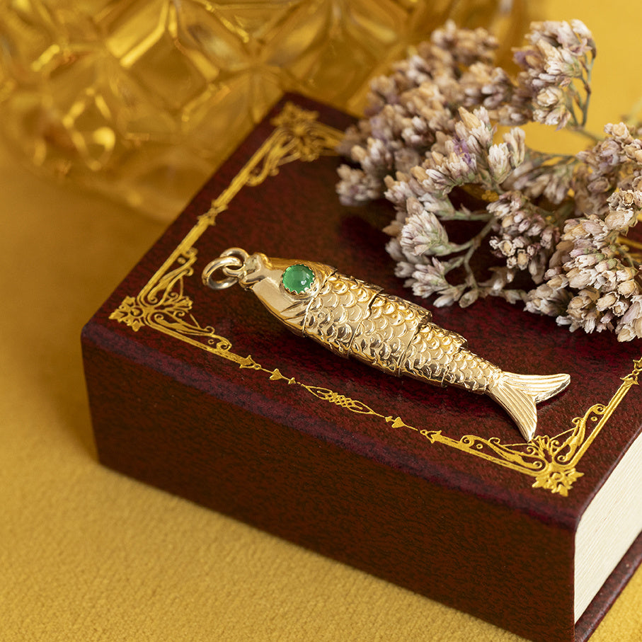 14 kt gold vintage fish pendant with colored stone