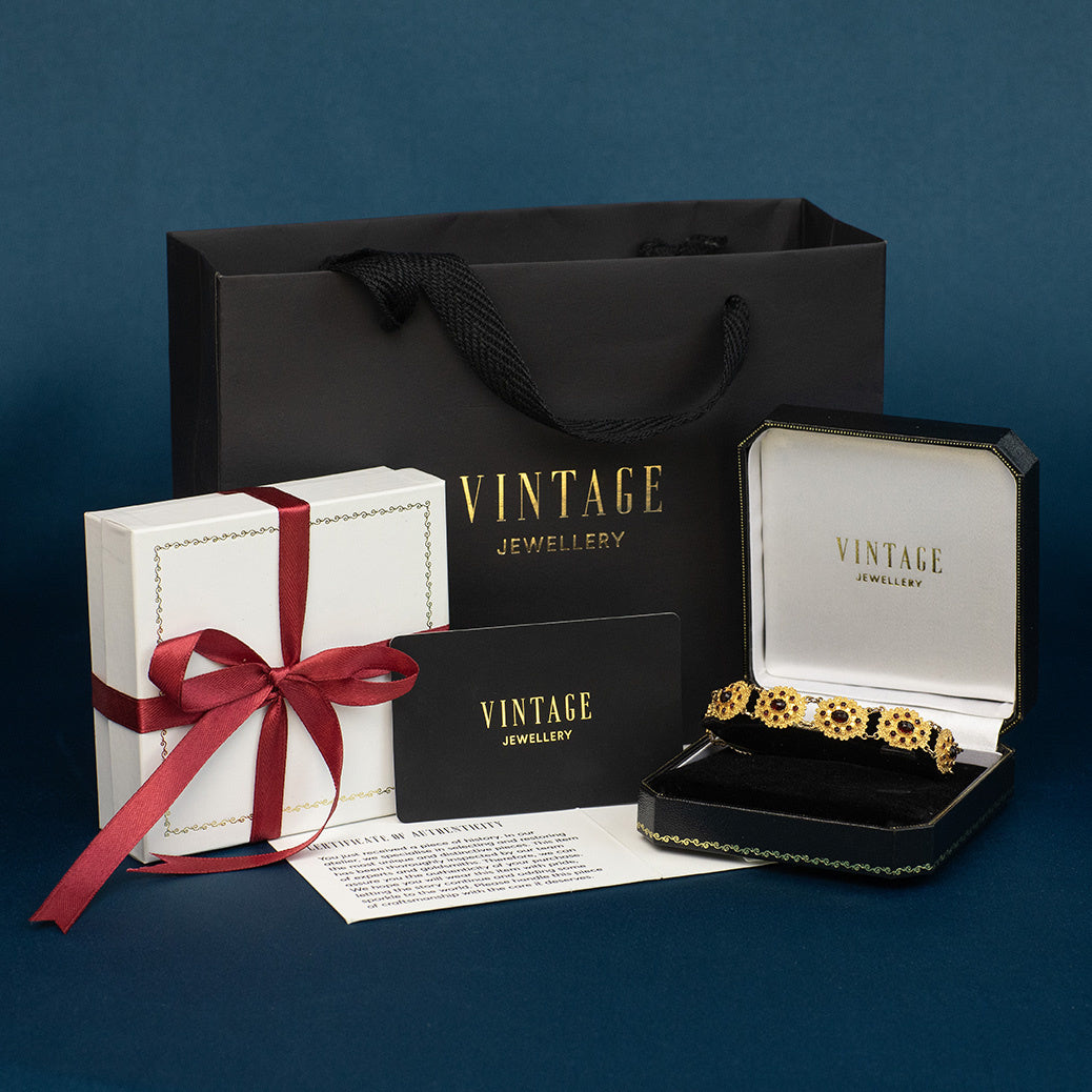 Gouden vintage entourage bootjes armband met granaat 14 krt