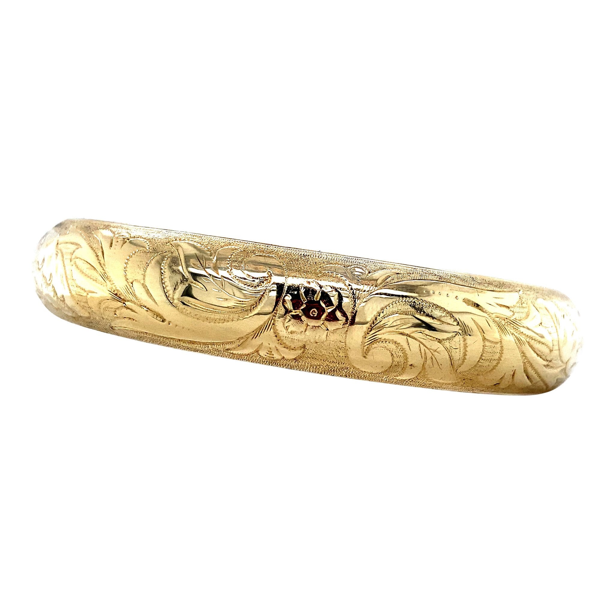 Gouden vintage bangle met gravure 14 krt