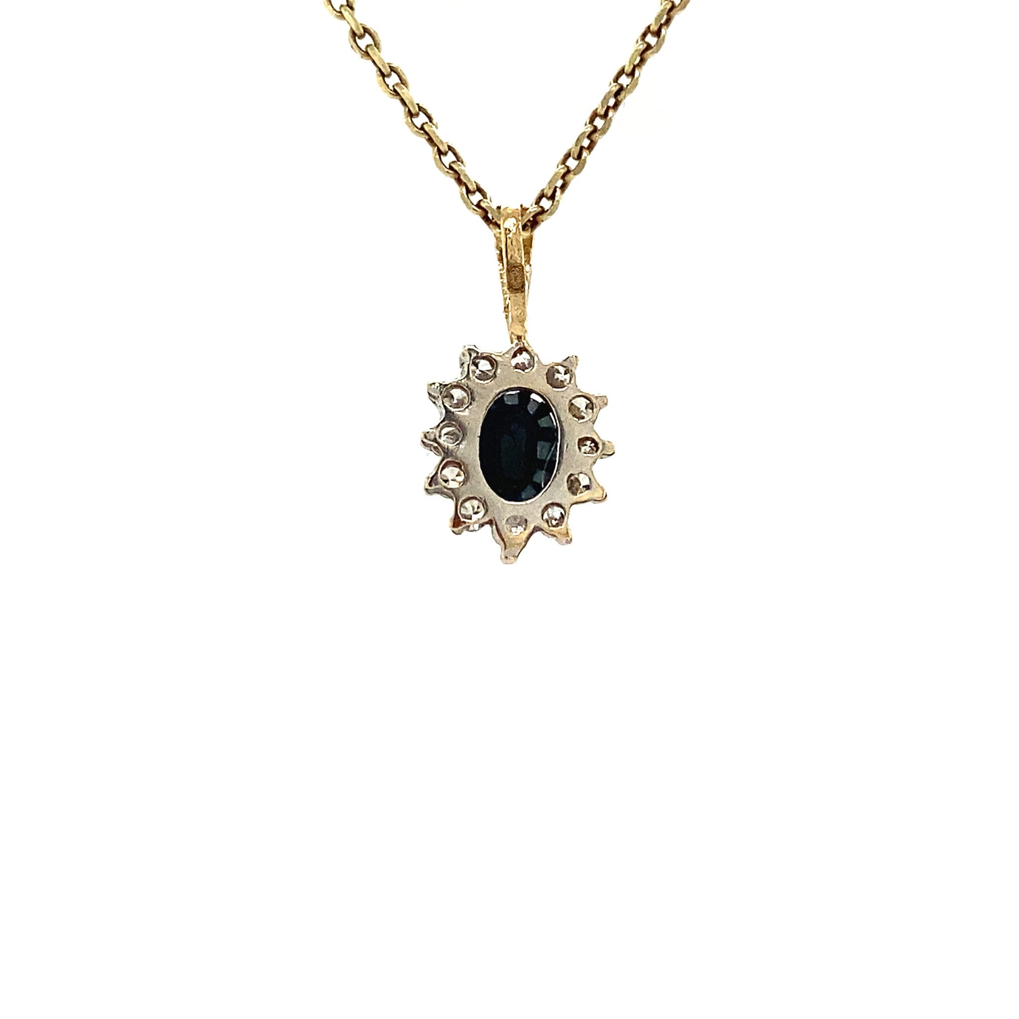 14 kt gold entourage pendant with sapphire and zirconia