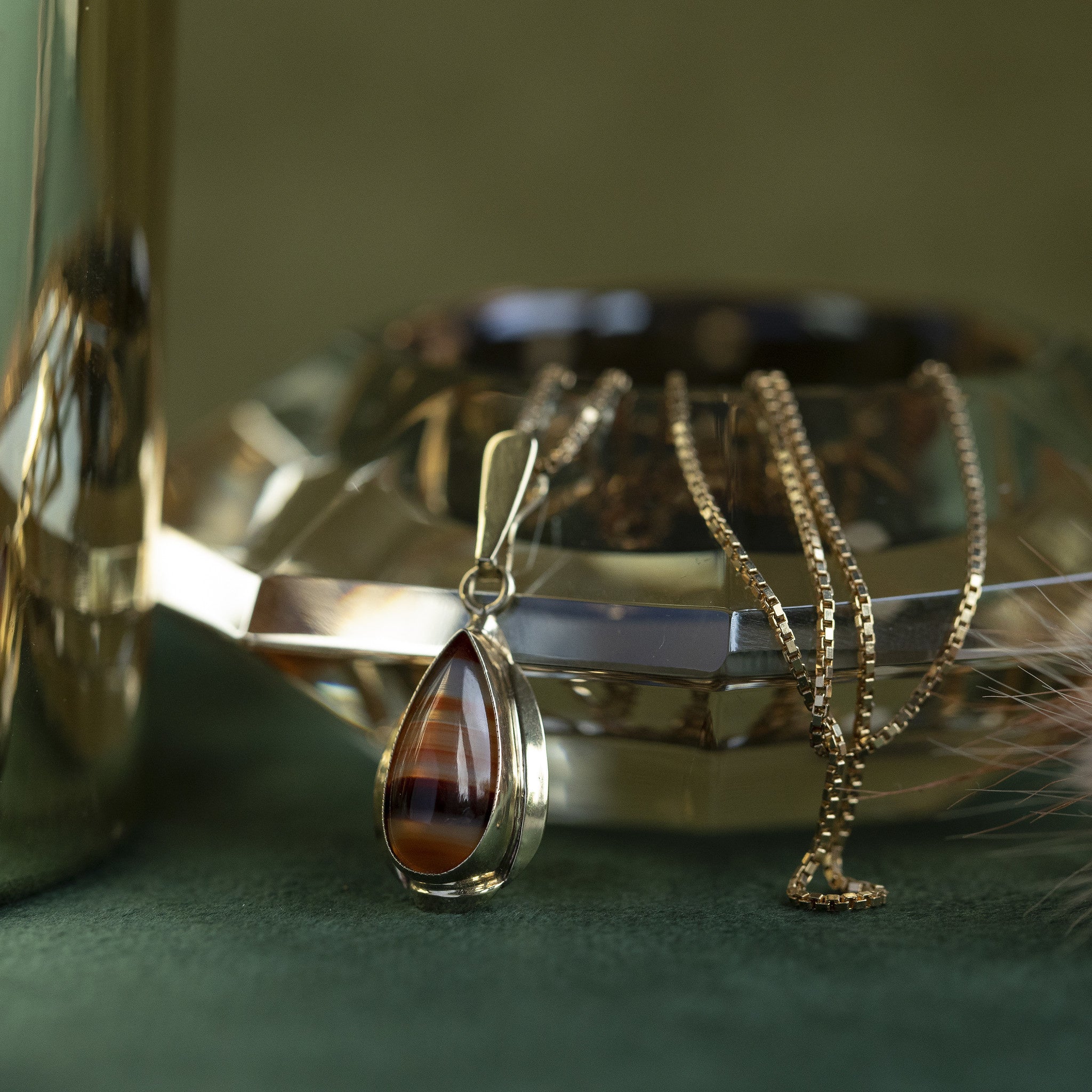 Gouden hanger met streepagaat 14 krt