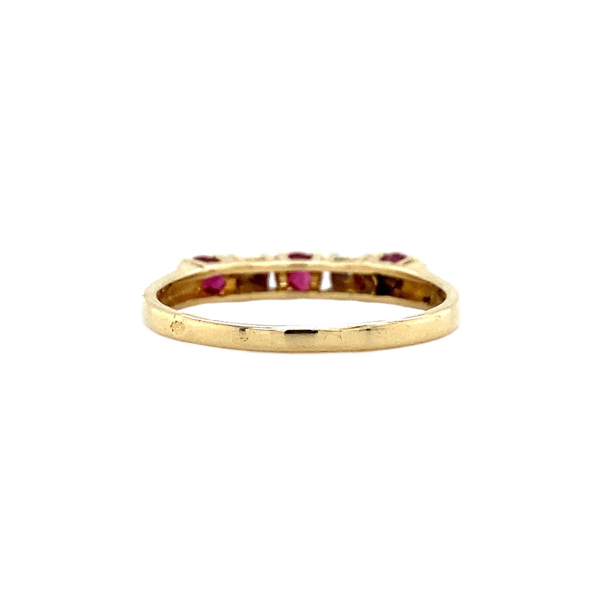 14 kt gold row ring with diamond and ruby