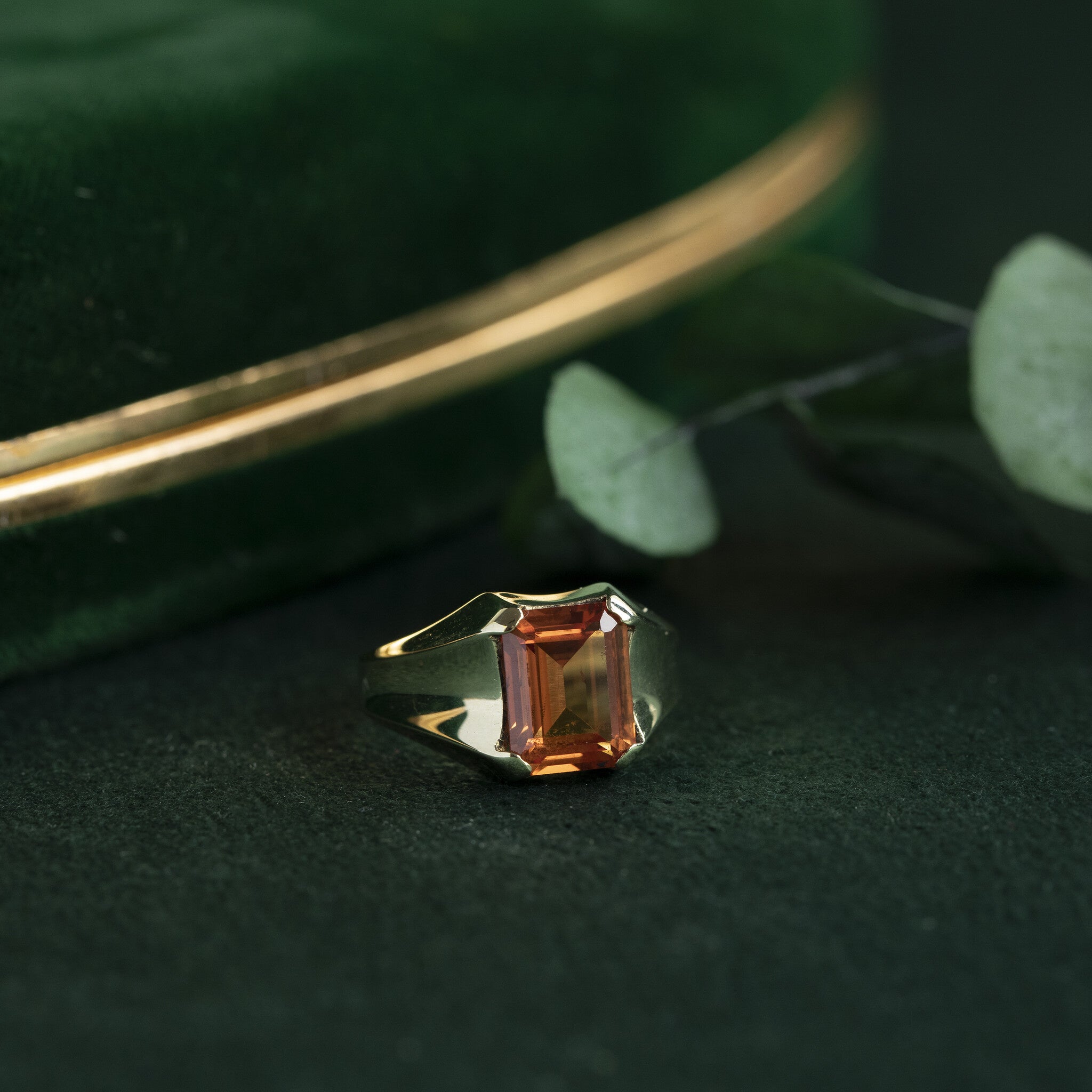 14 kt gold pinky ring with an orange sapphire