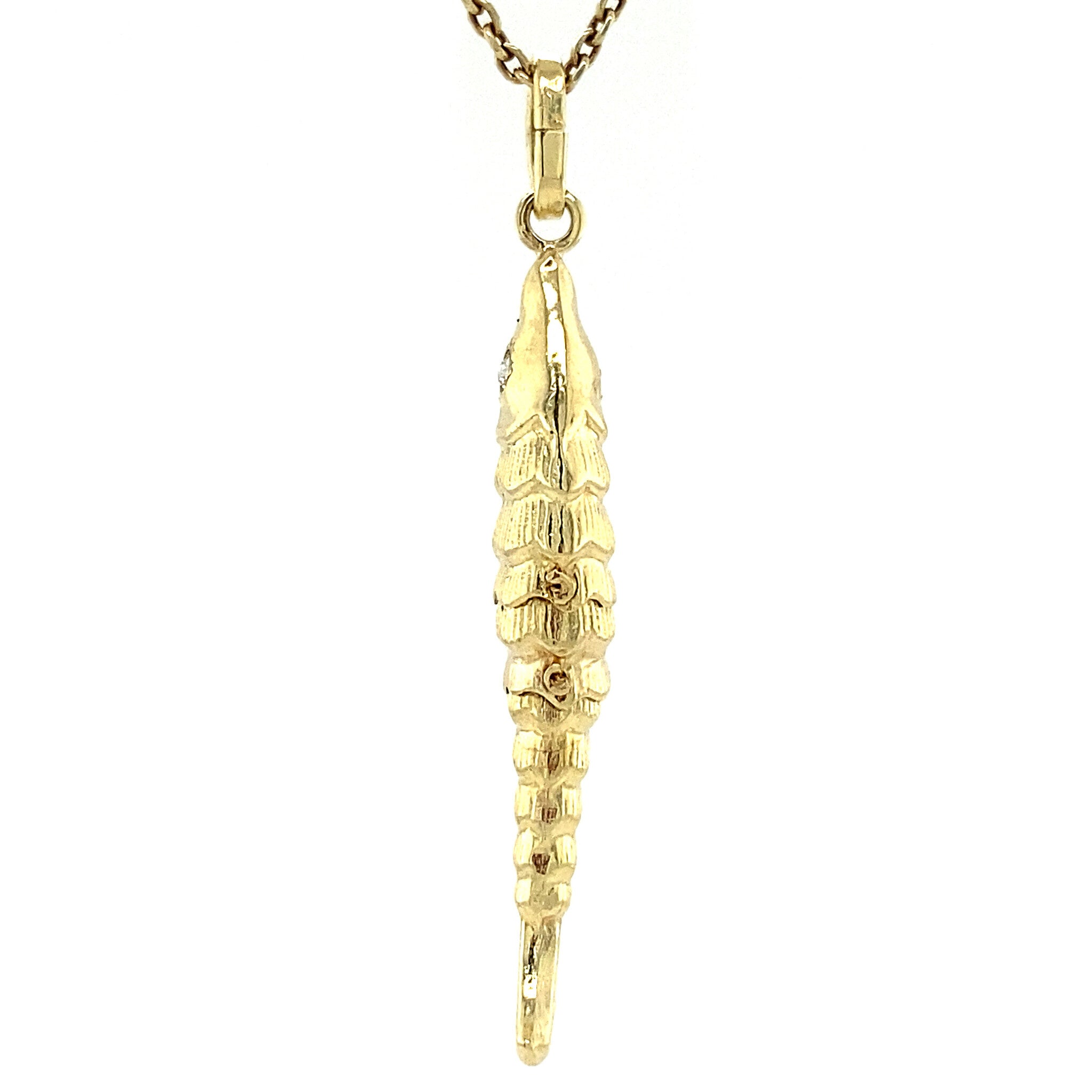 14 kt gold fish pendant with zirconia