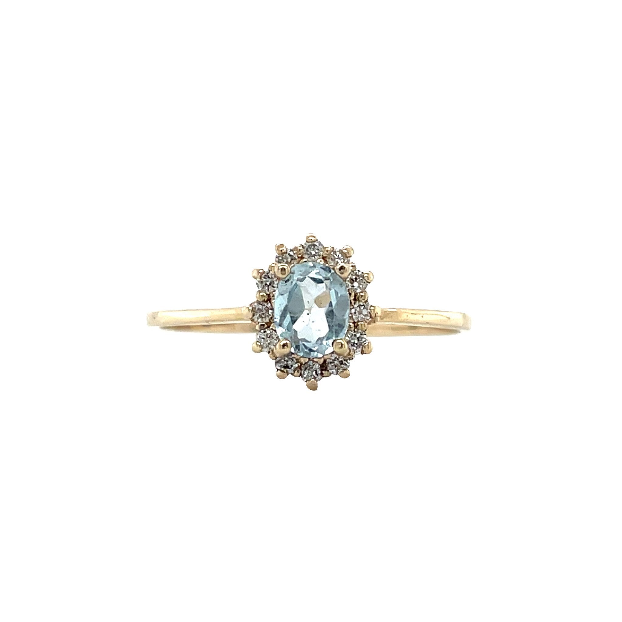 Vintage gold entourage ring with aquamarine and diamond, 14 kt