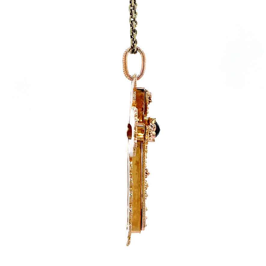 14 kt gold cross pendant with garnet
