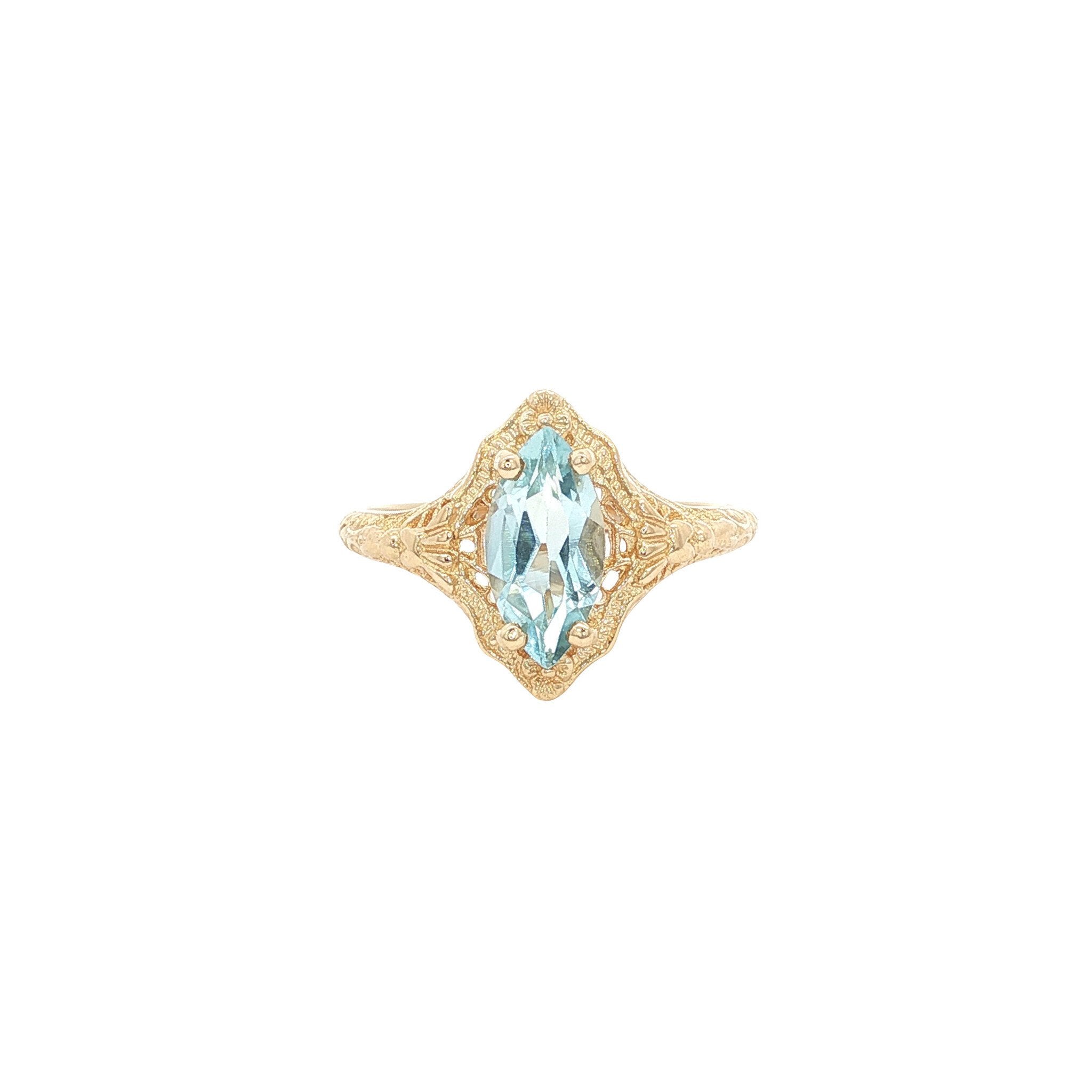 Gouden ring met blauwe topaas 14 kt