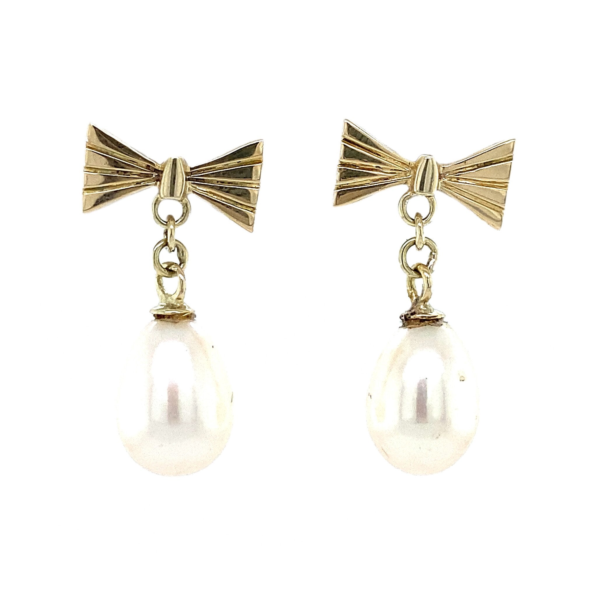 14 kt gold bow stud earrings with pearl