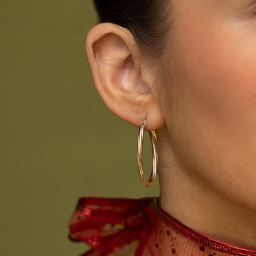 Getordeerde vintage oorringen 9 kt