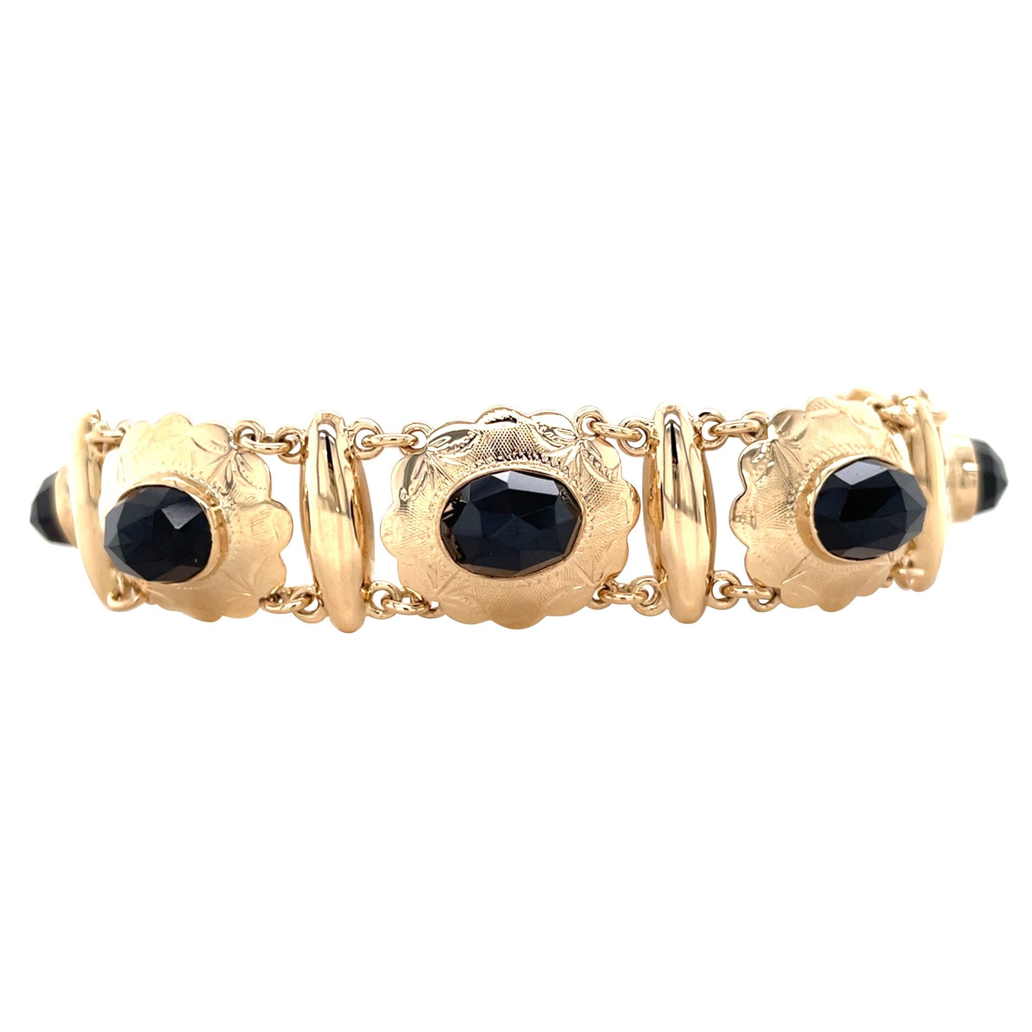 Gouden vintage bootjes armband met granaat 14 kt