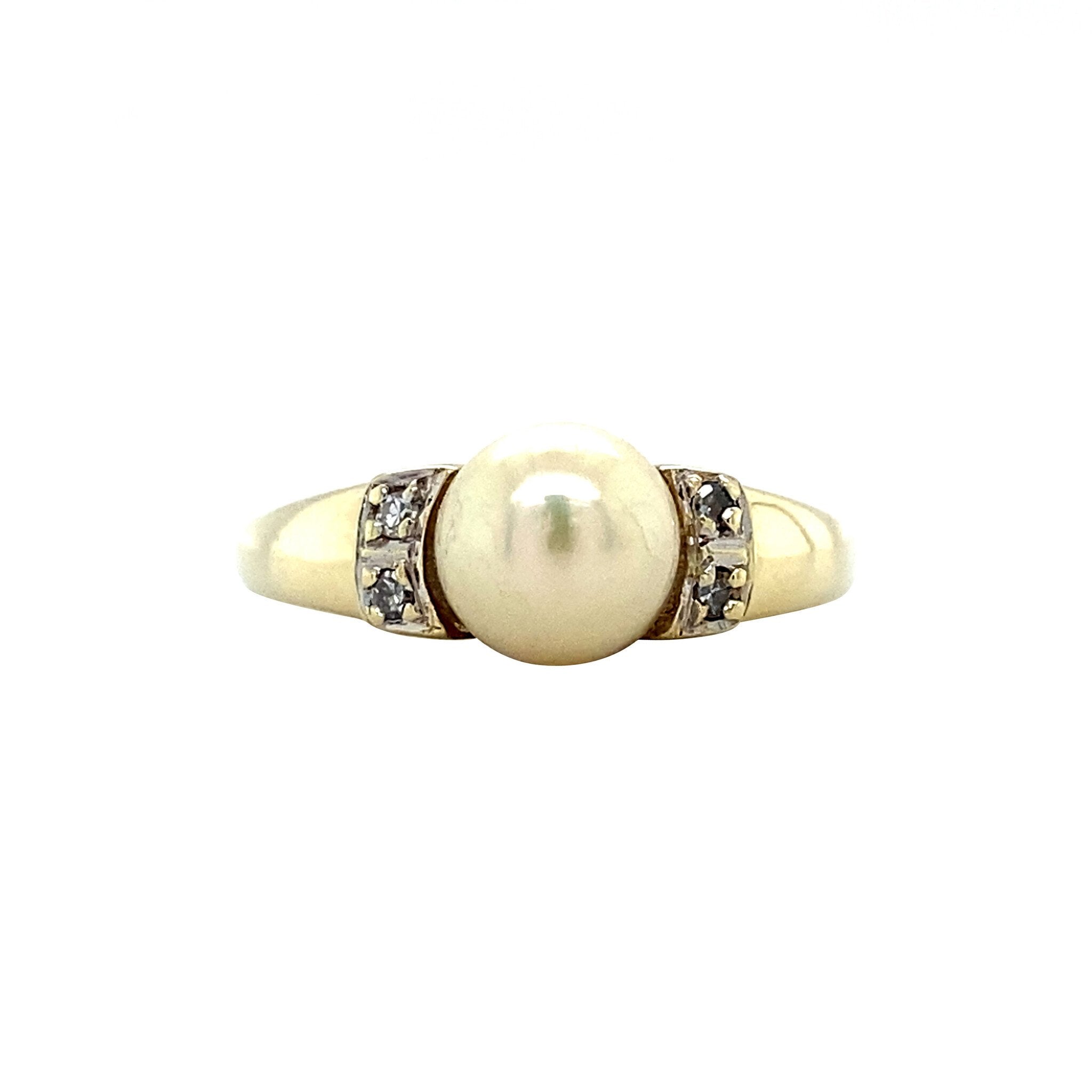 Gouden ring met parel en diamant 14 krt