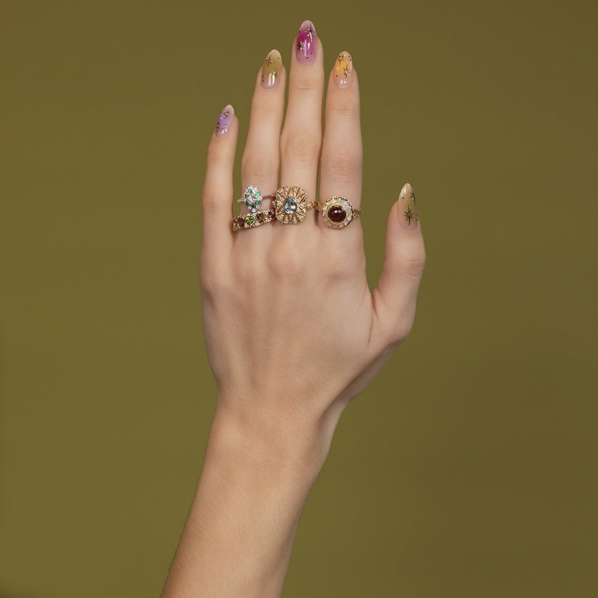 Gouden ring met blauwe topaas en parel 14 kt