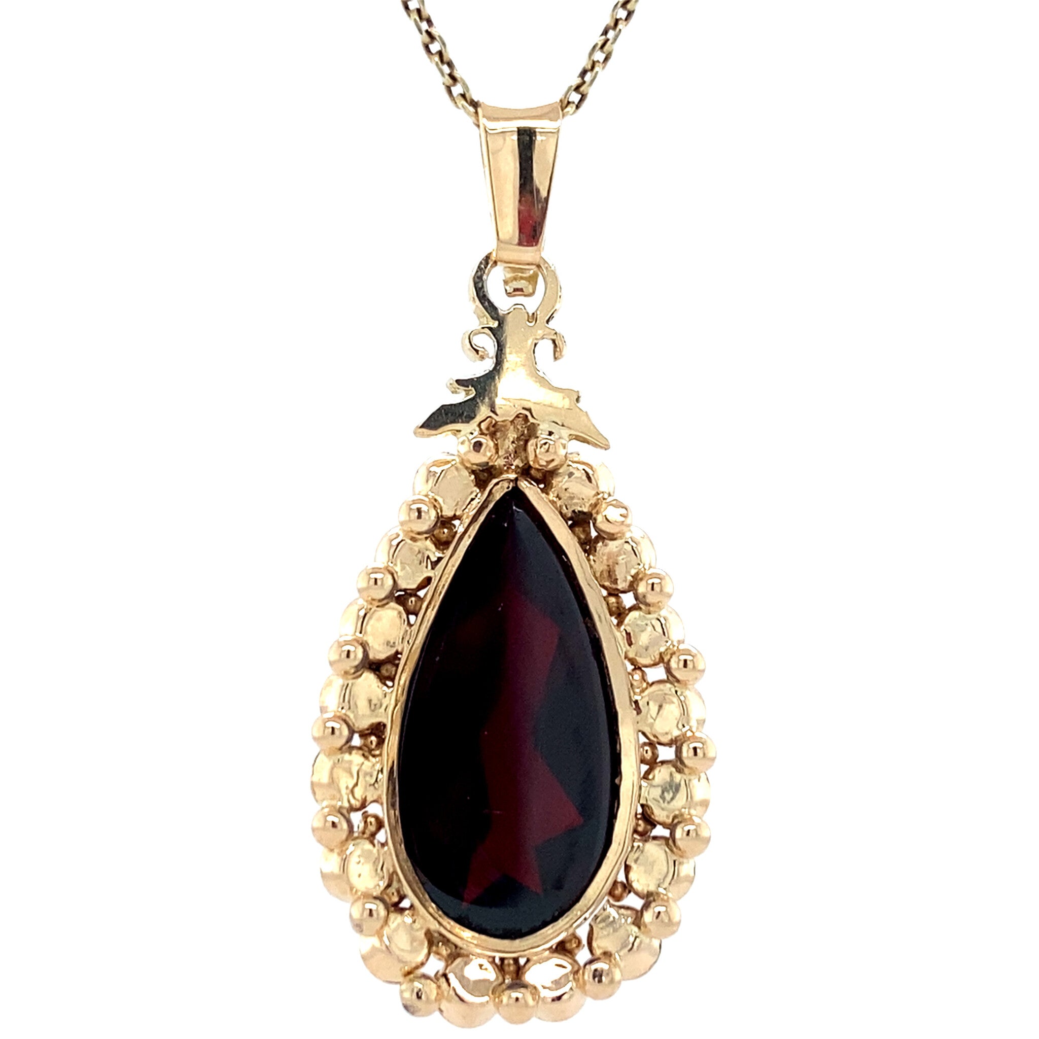Gold entourage pendant with garnet 14 kt