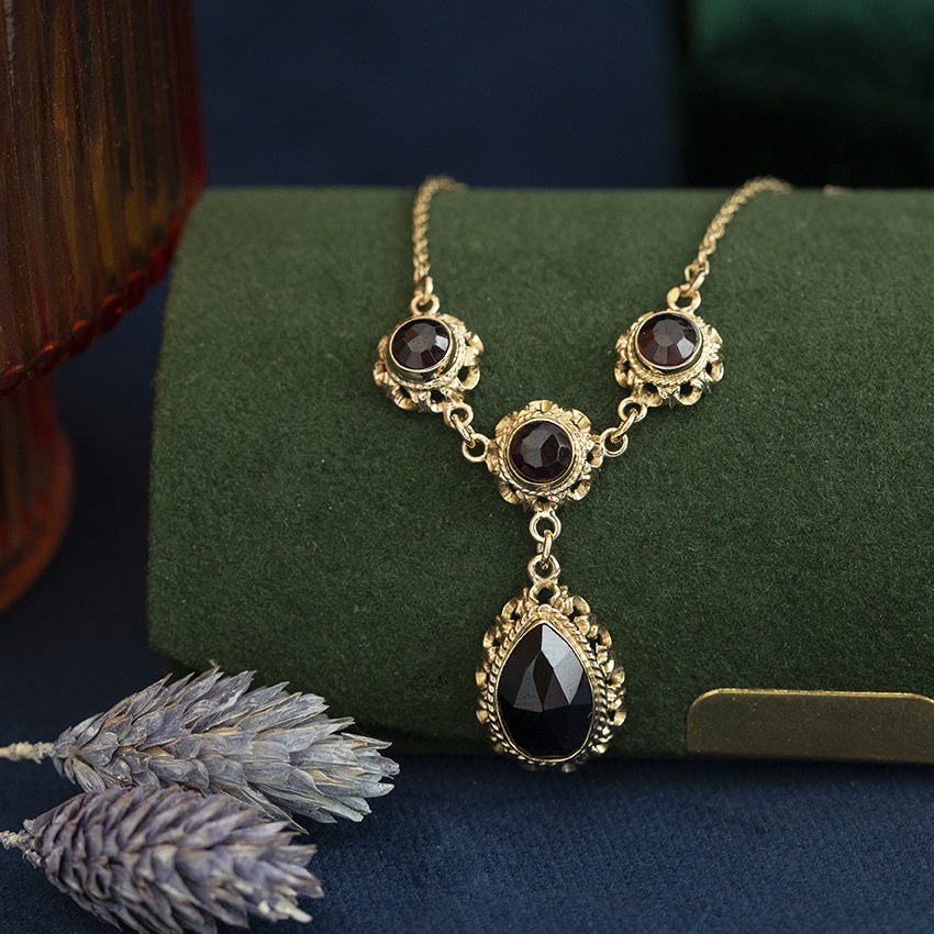 Gouden vintage koord collier met granaat 14 kt