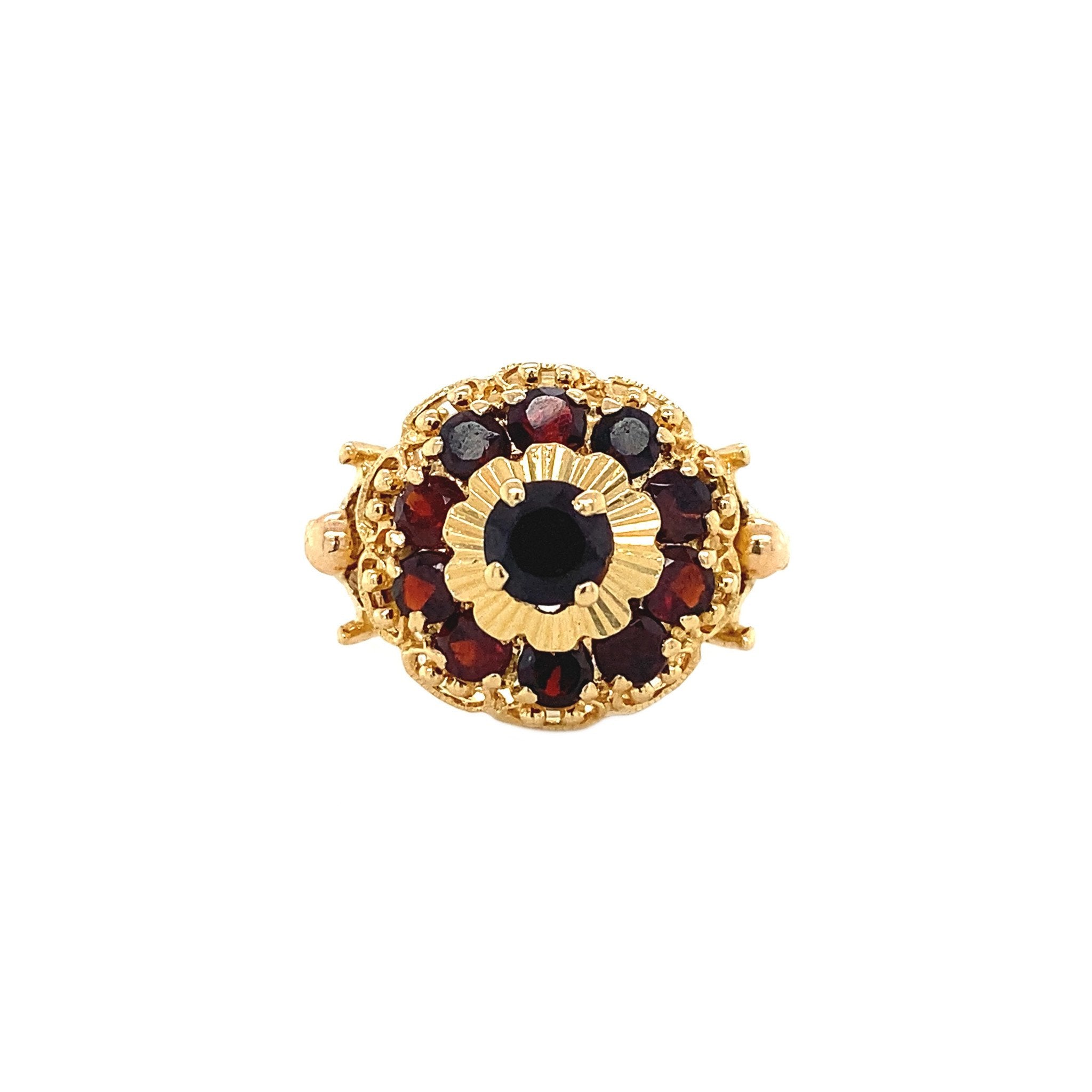 18 kt gold halo ring with garnet