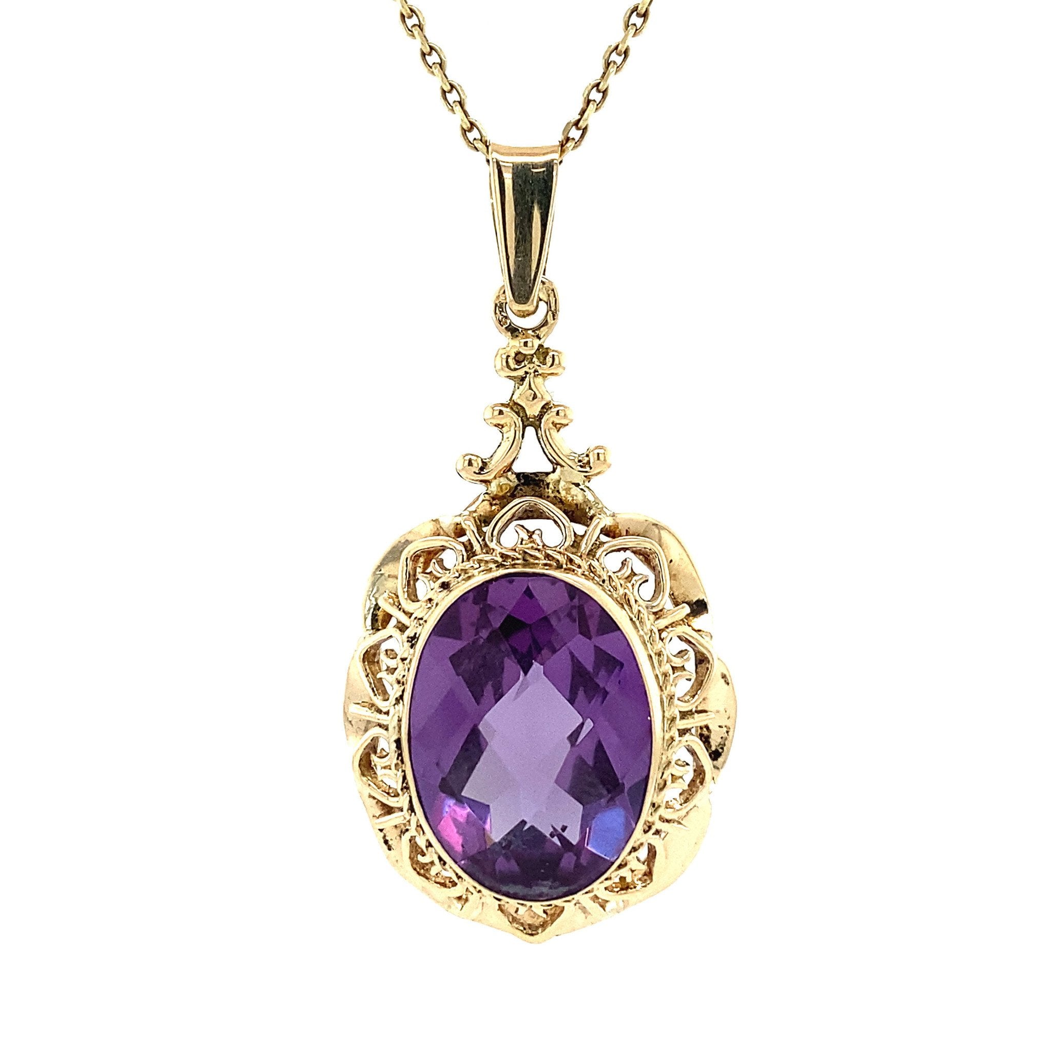 14 kt gold pendant with purple sapphire