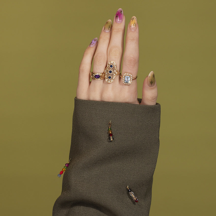 Gouden ring met blauwe topaas en parel 14 kt