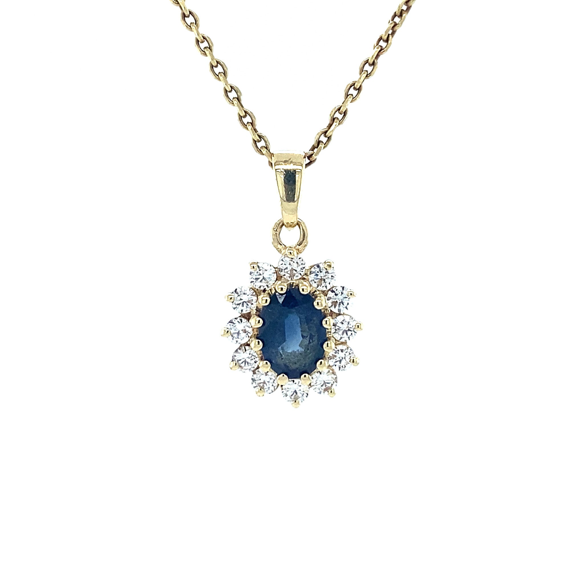 14 kt gold halo pendant with zirconia and sapphire