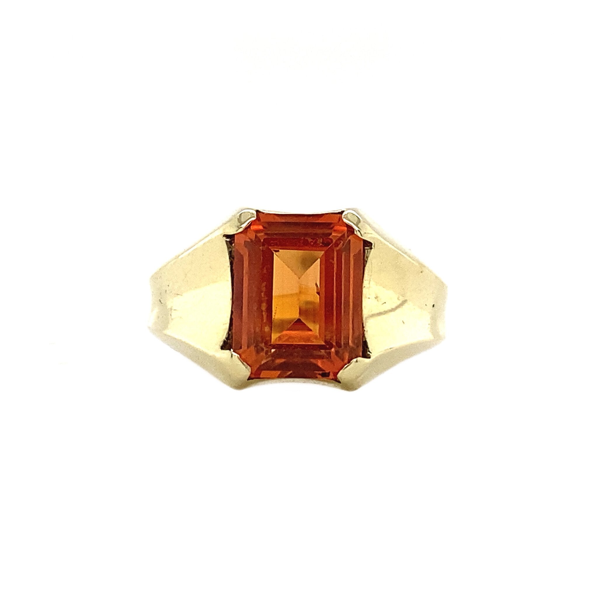 14 kt gold pinky ring with an orange sapphire