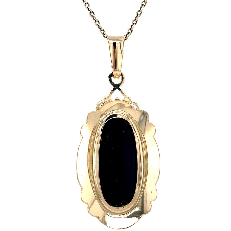 Golden vintage pendant with garnet 14 kt