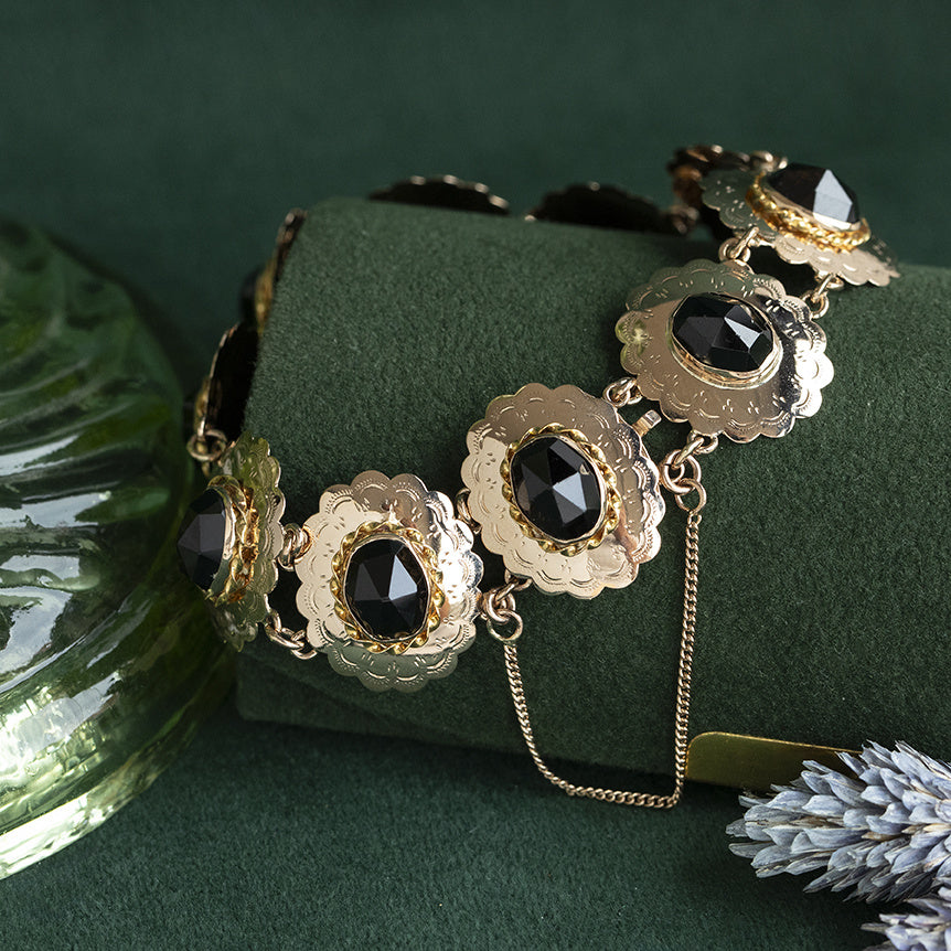 Gouden vintage bootjes armband met granaat 14 kt