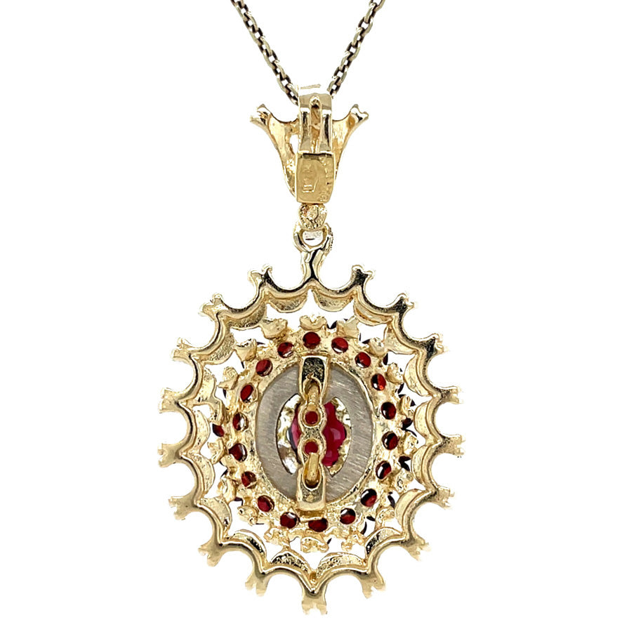 Vintage gold entourage pendant with garnet, 14 kt