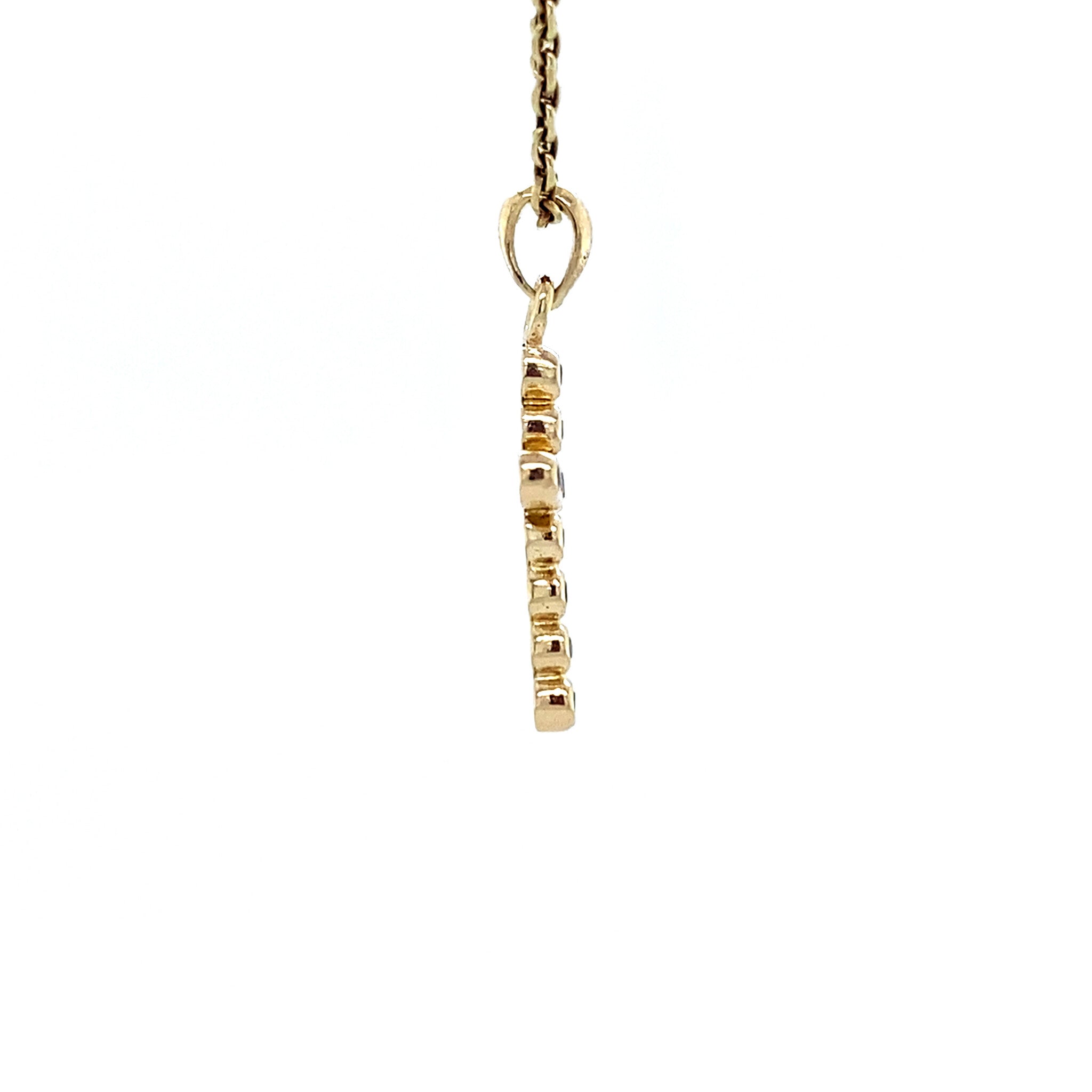 14 kt gold cross pendant with diamond