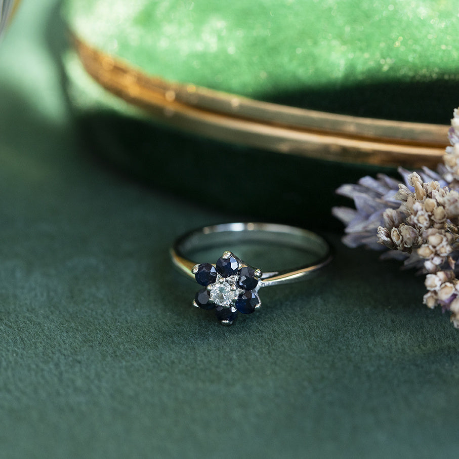 Vintage 12 kt gold entourage ring with sapphire and diamond