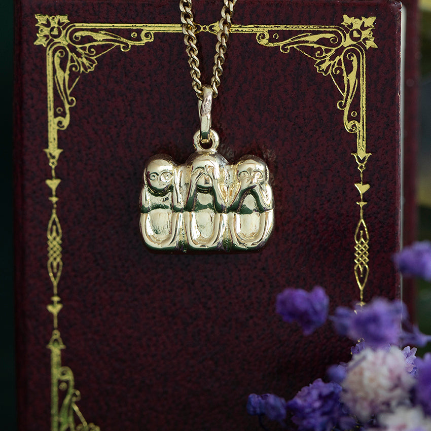 14 kt gold "hear no evil, see no evil, speak no evil" pendant