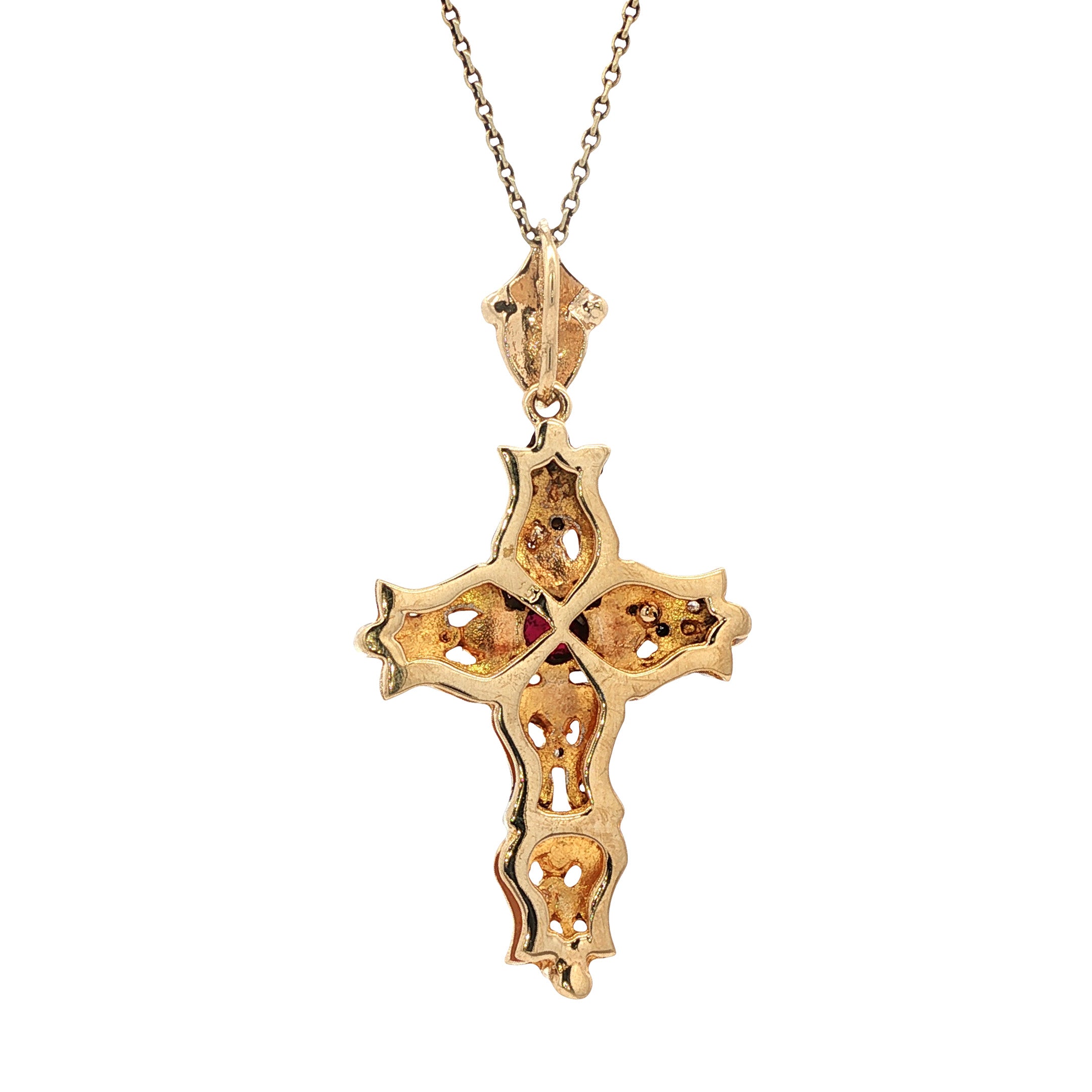 12 kt two-tone cross pendant with ruby and zirconia
