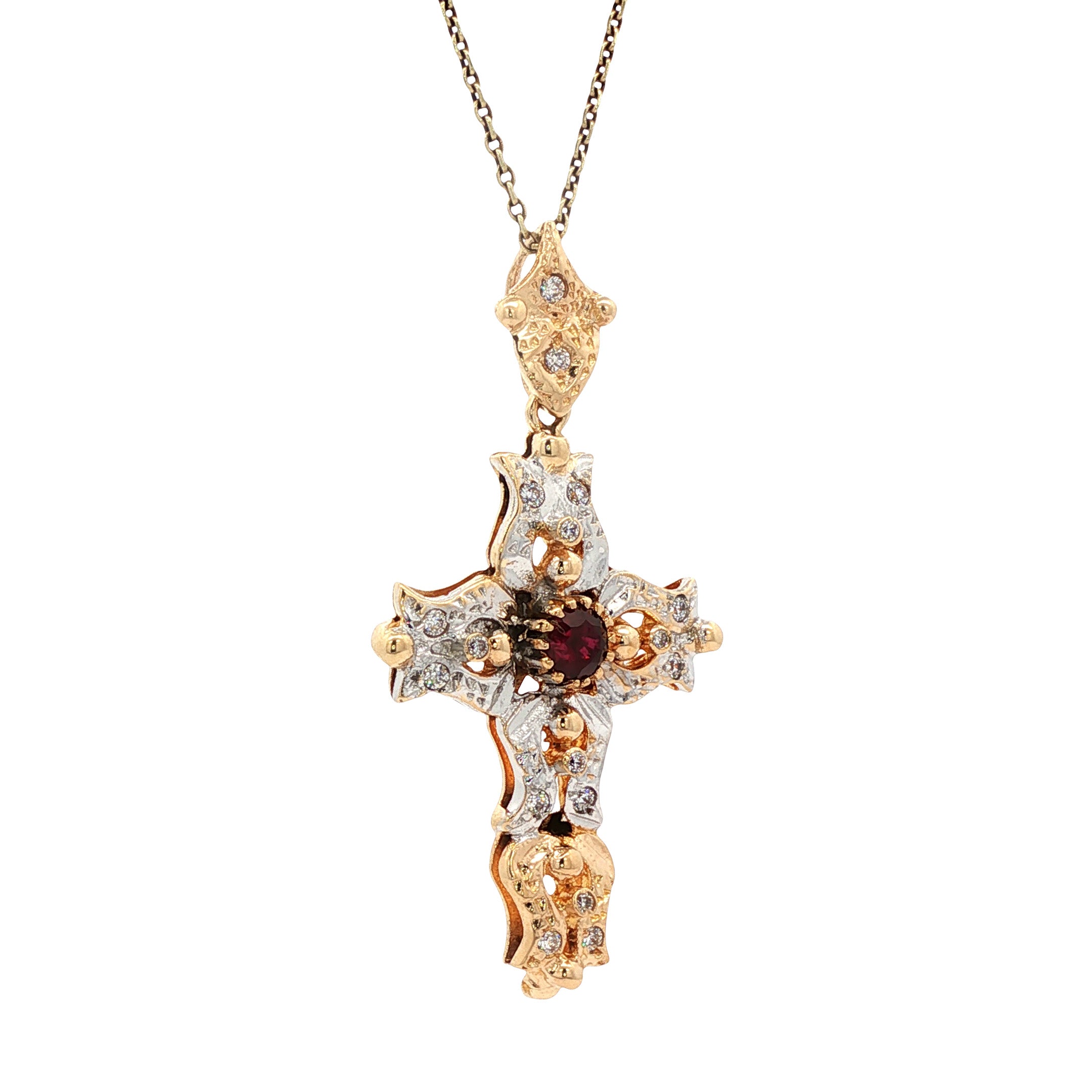 12 kt two-tone cross pendant with ruby and zirconia