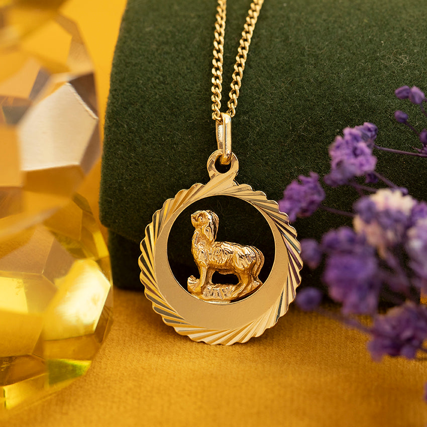 14 kt gold ram pendant