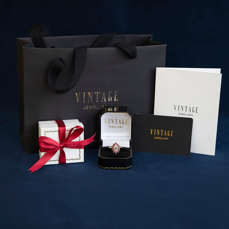 Gold snake ring with coloured stone 14 kt