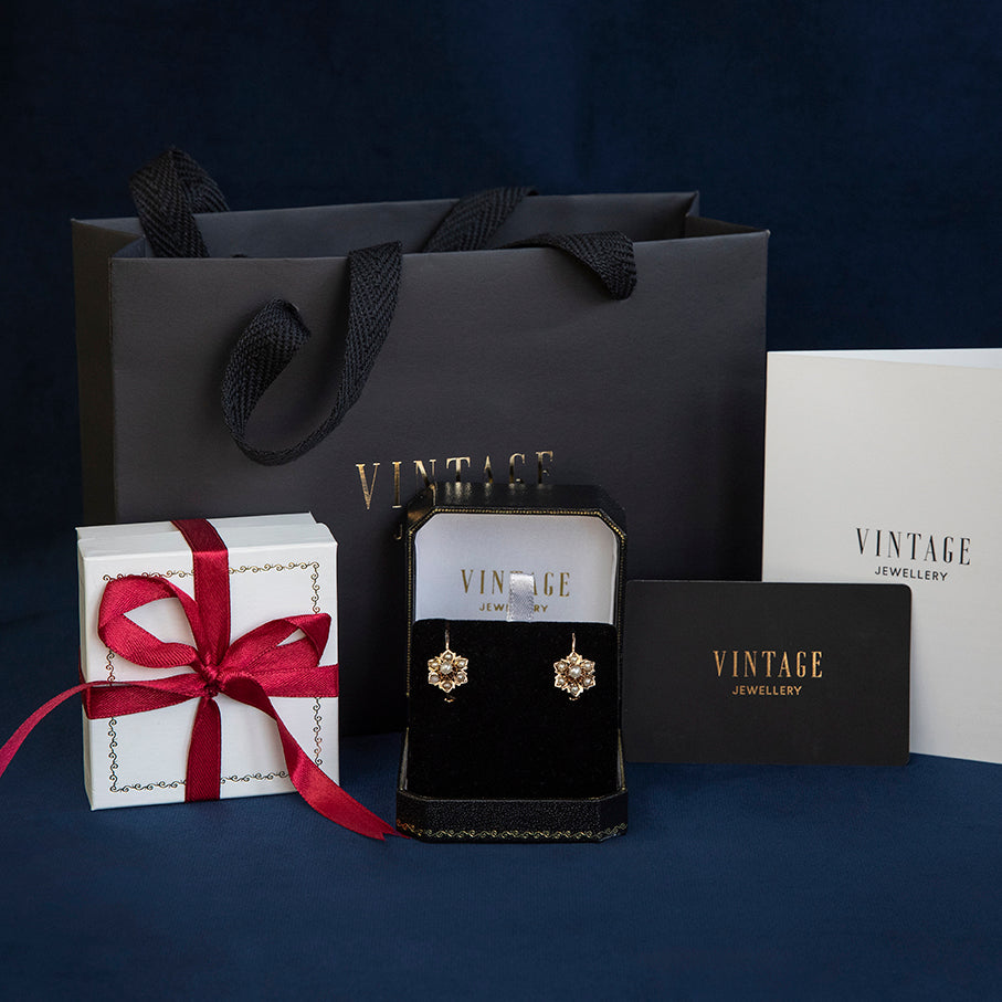 Gouden vintage fantasie oorringen 14 kt