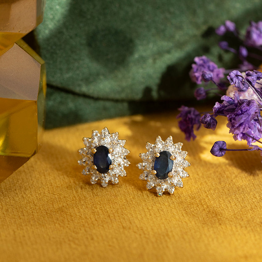 Gold stud earrings with sapphire and diamond, 14 kt