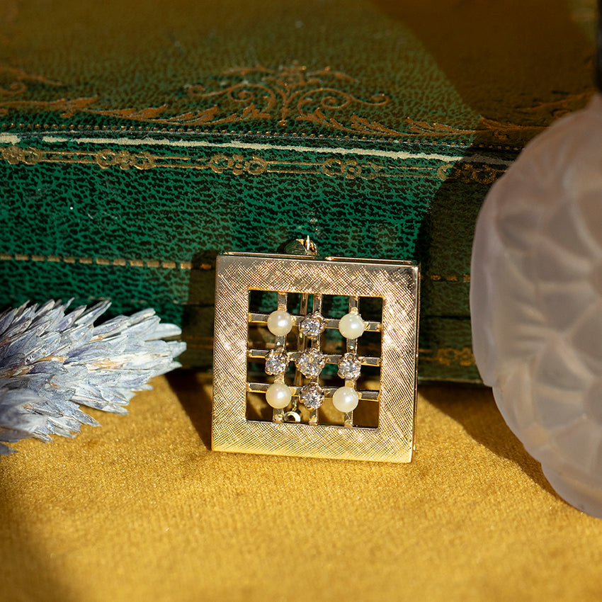 Gouden broche met parel en diamant 14 kt