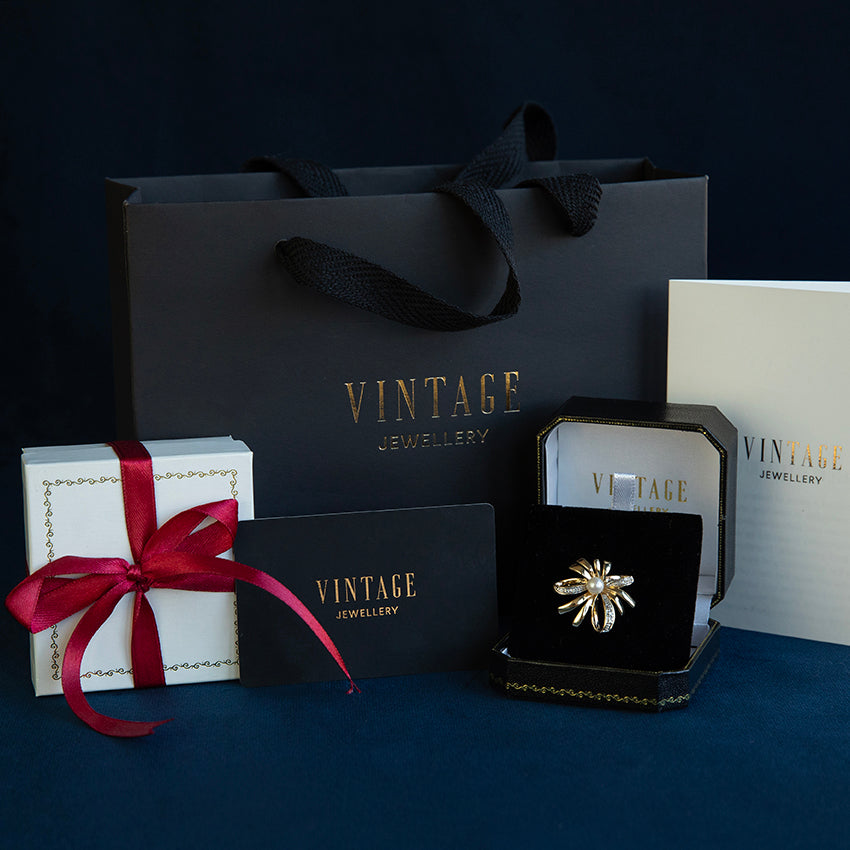 Gouden broche met parel en diamant 14 kt