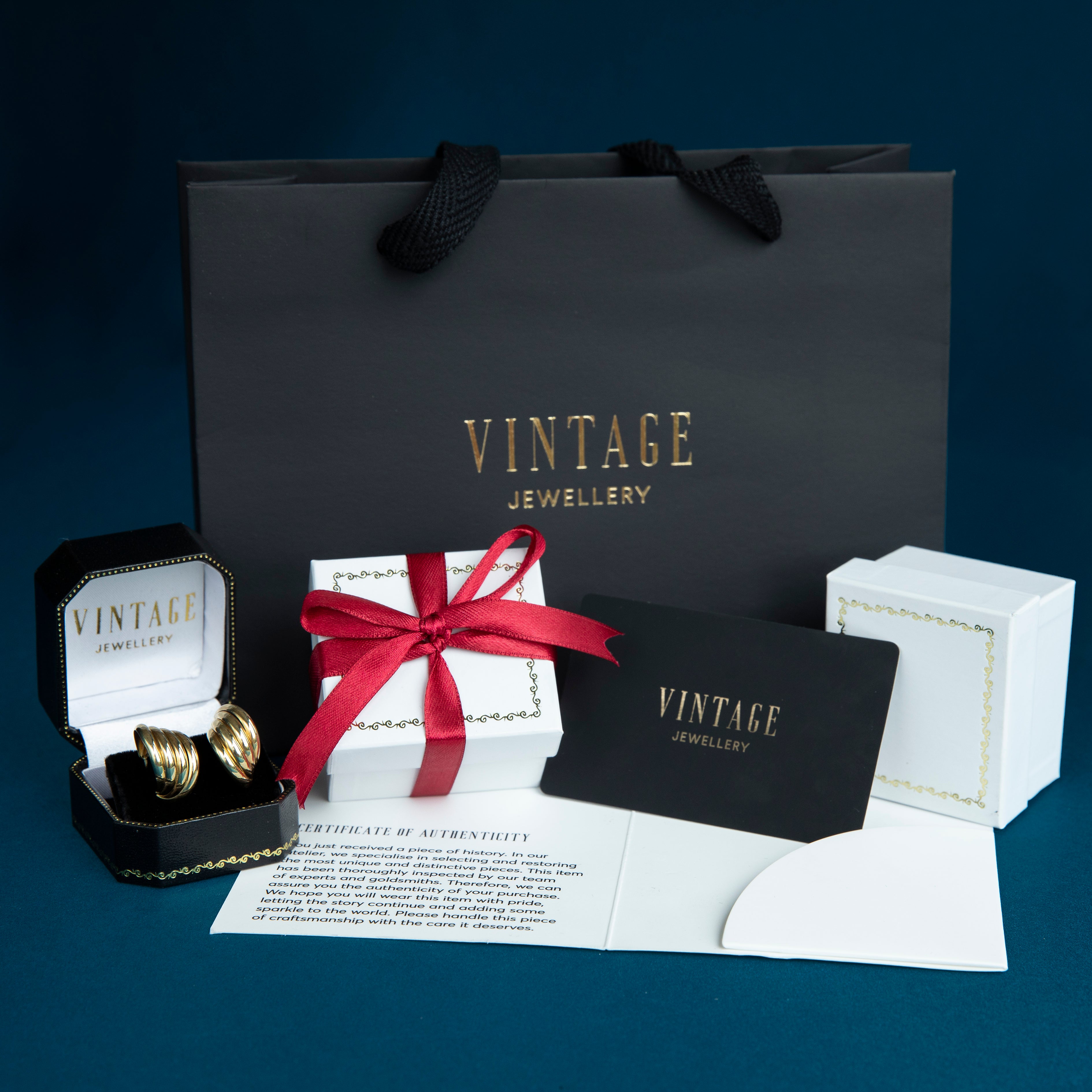 Bicolour gouden oorstekers 14 kt