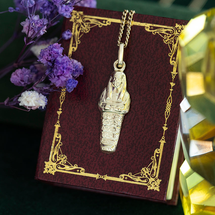 14 kt gold mummy pendant