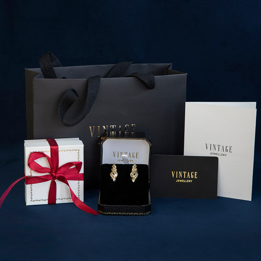 Witgouden vintage oorstekers met saffier en diamant 18 kt