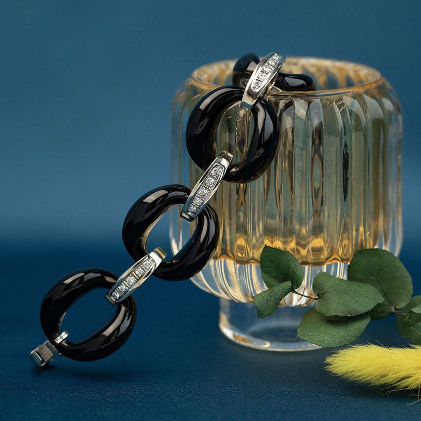 Witgouden vintage armband met onyx en diamant 14 krt