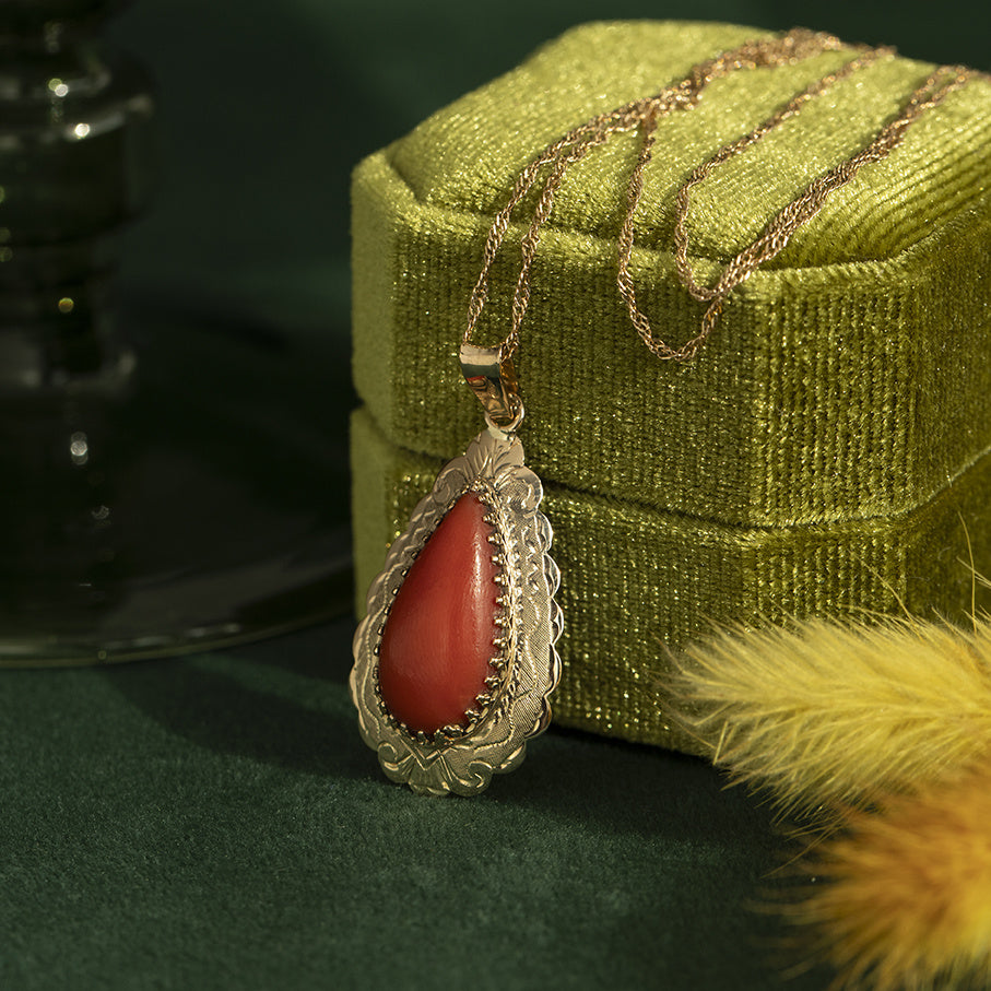 Golden vintage pendant with blood coral 14 kt