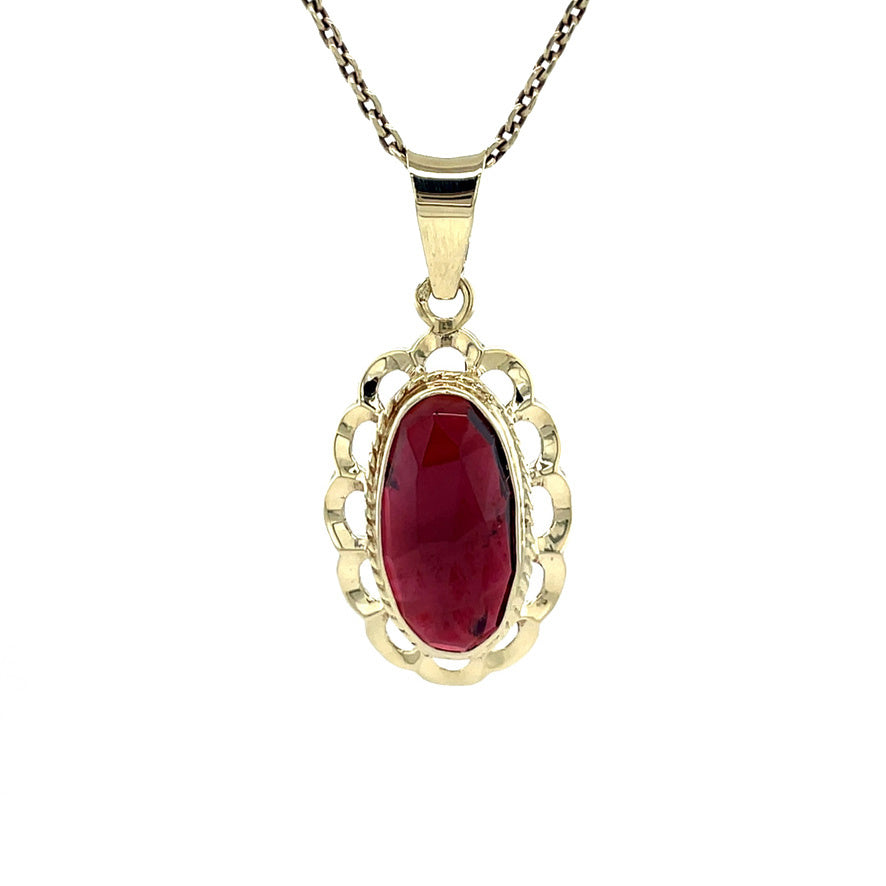Gold vintage pendant with garnet 14 kt