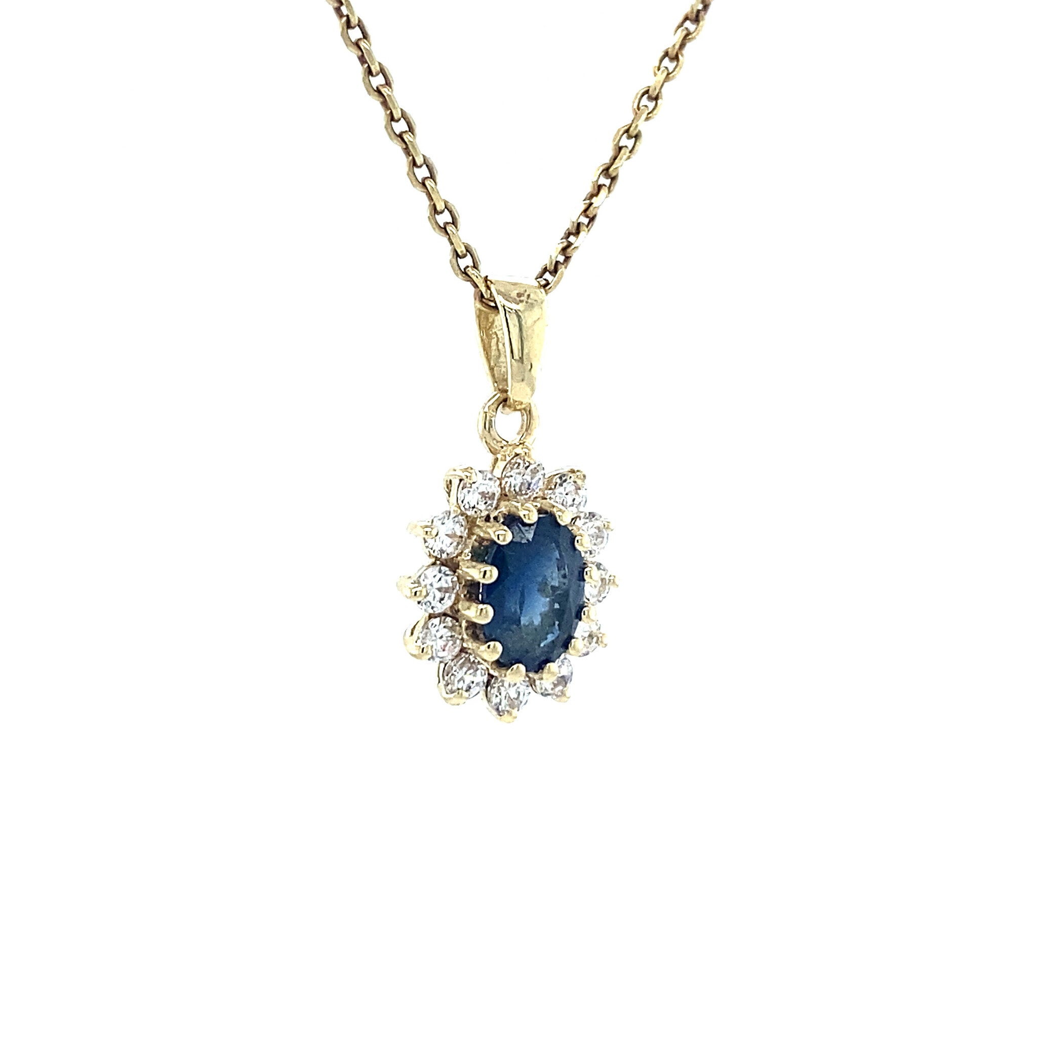 14 kt gold halo pendant with zirconia and sapphire