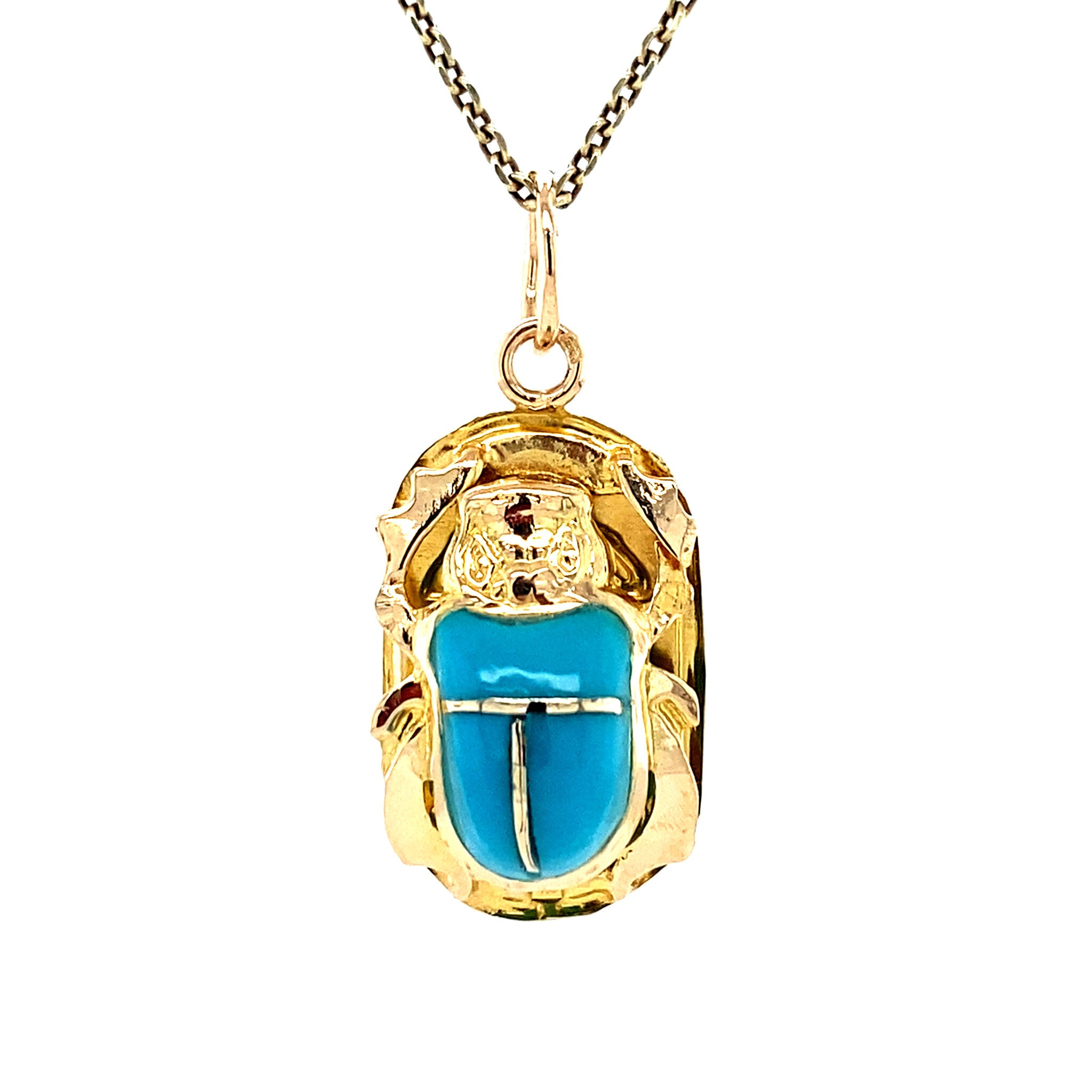 18 kt gold scarab pendant with blue gemstone