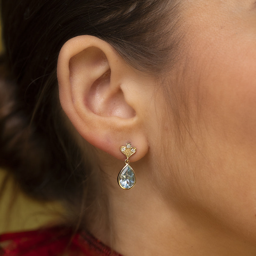 Gold earrings with topaz and diamond 14 kt
