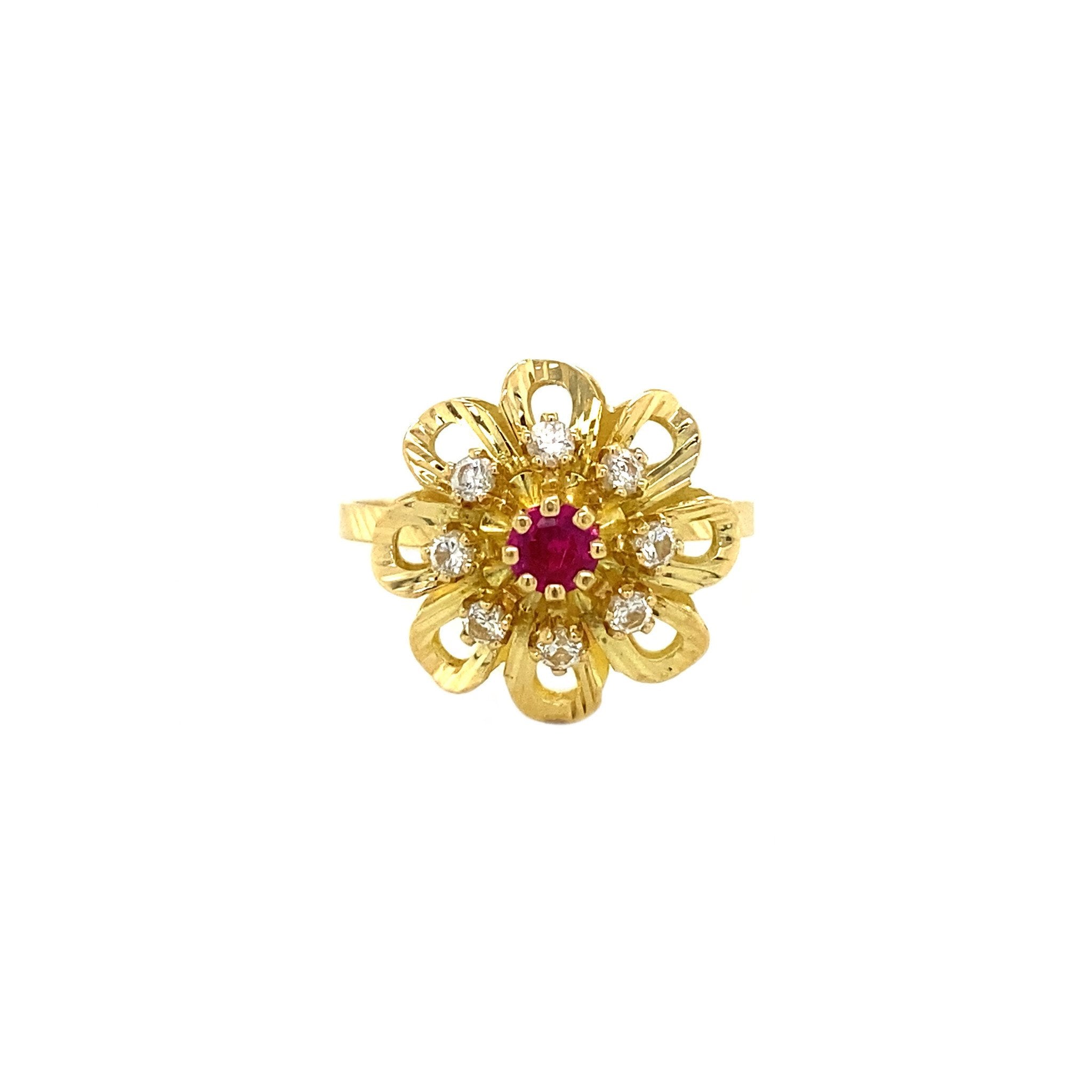 18 kt gold ring with ruby and zirconia
