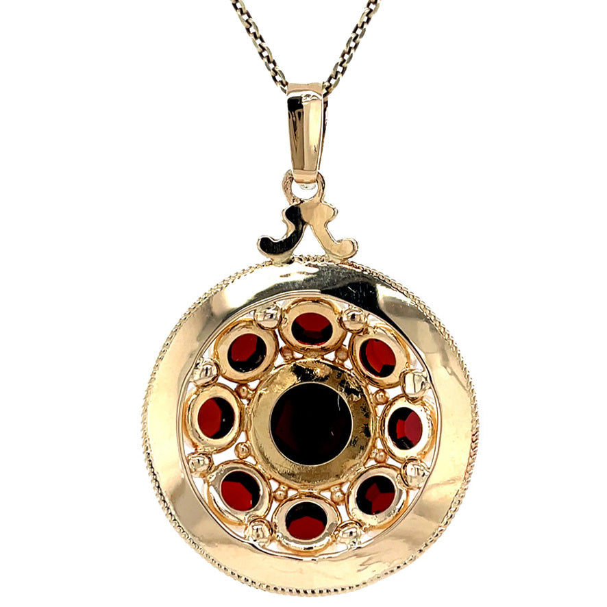 Vintage gold pendant with garnet 14 krt