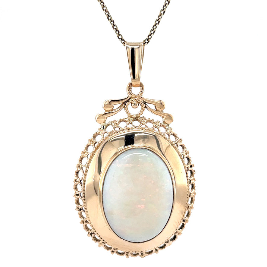 Golden vintage pendant with opal 14 kt