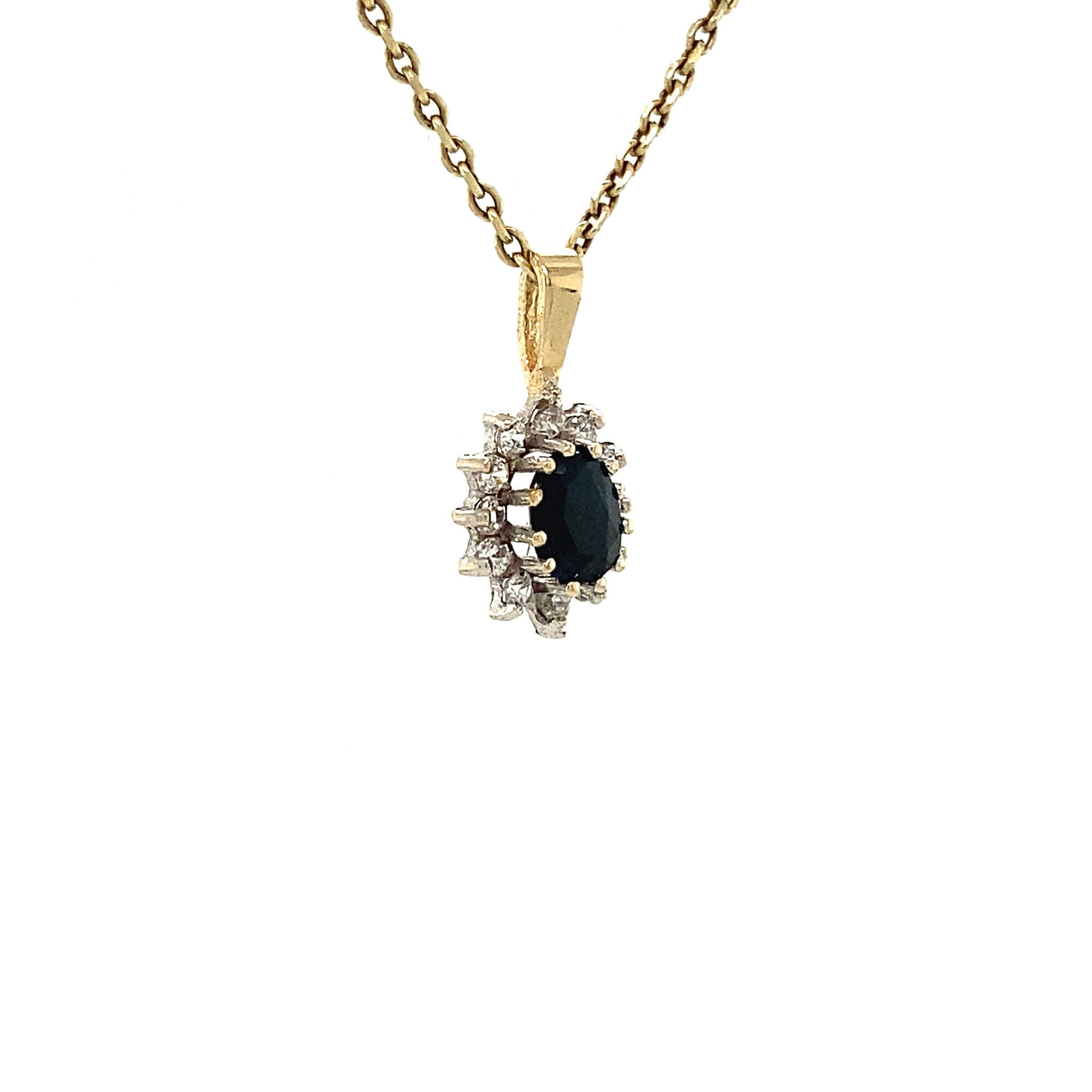 14 kt gold entourage pendant with sapphire and zirconia
